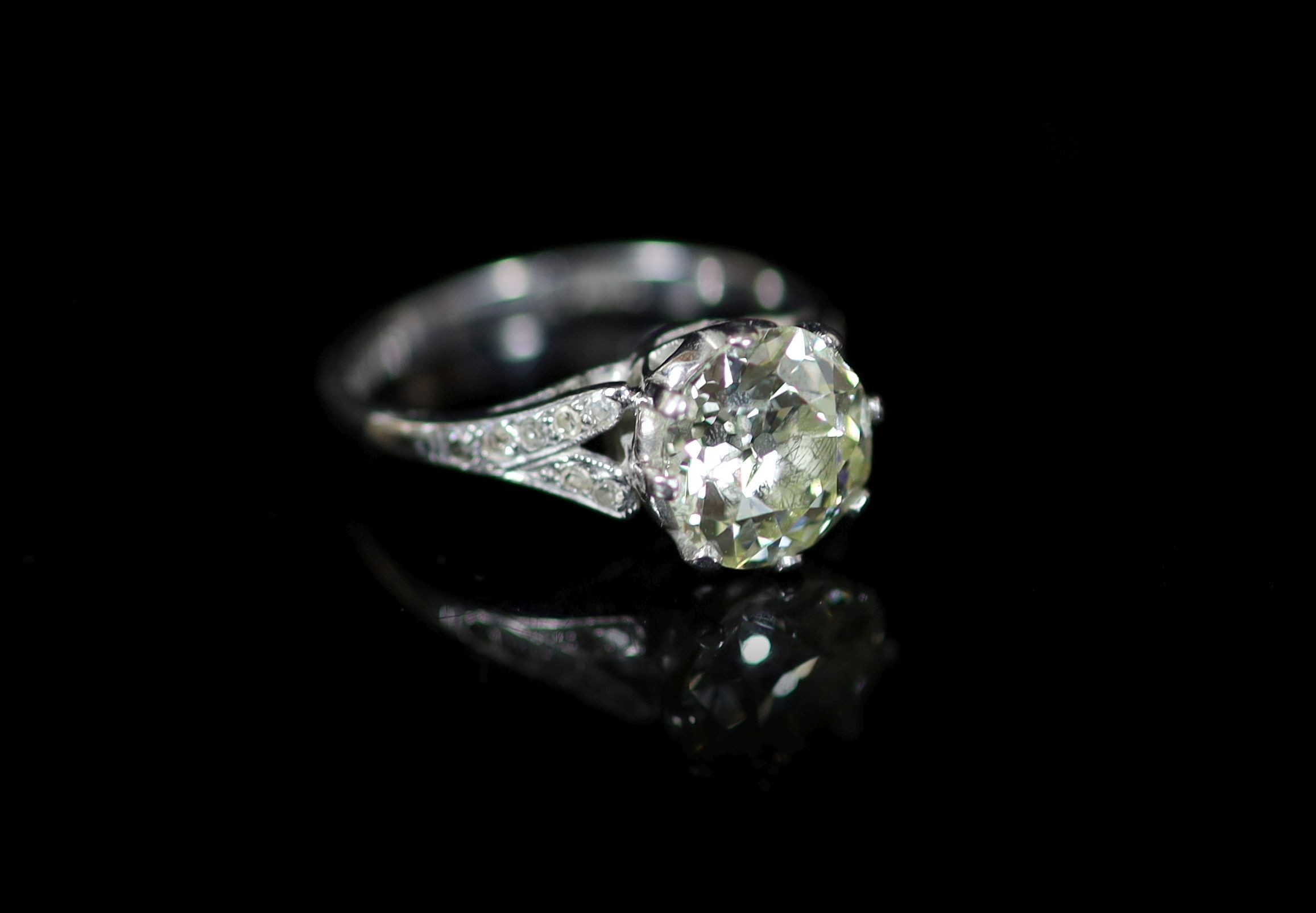 A 20th century 18ct white gold and platinum set single stone diamond ring, with diamond set shoulders